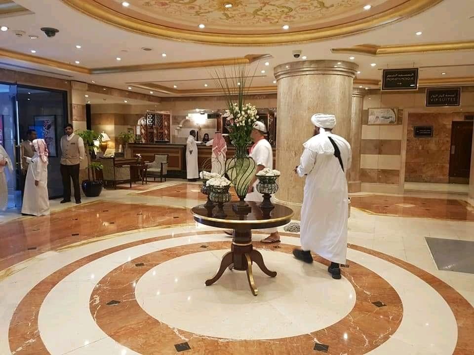 Hotel lobby with staff welcoming guests