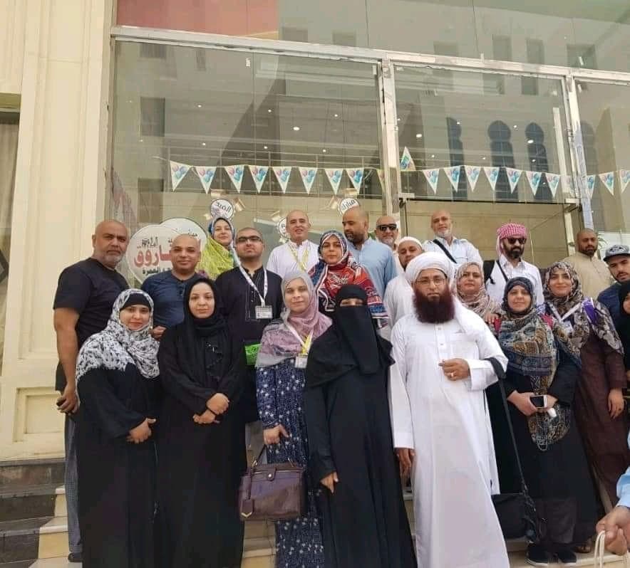 Pilgrim group photo outside the service office